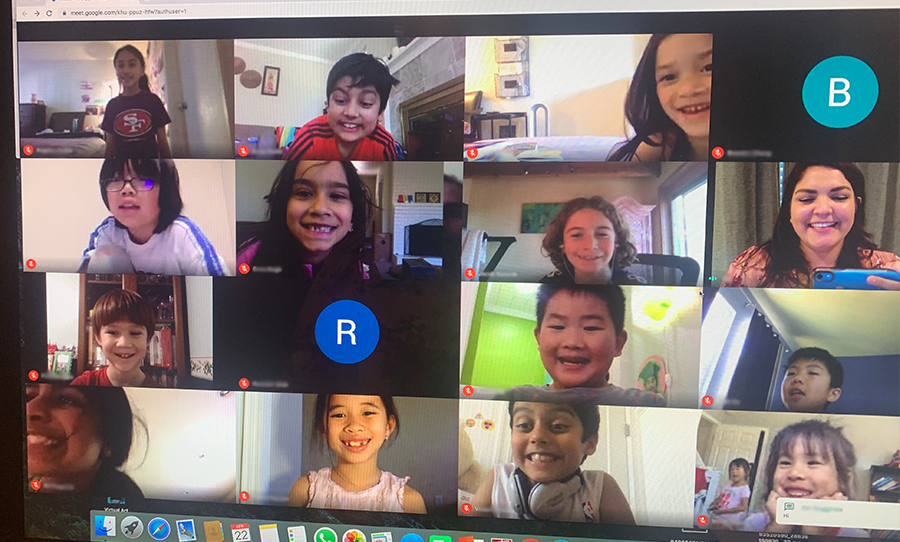 Smiling students meet on Zoom for a music lesson.